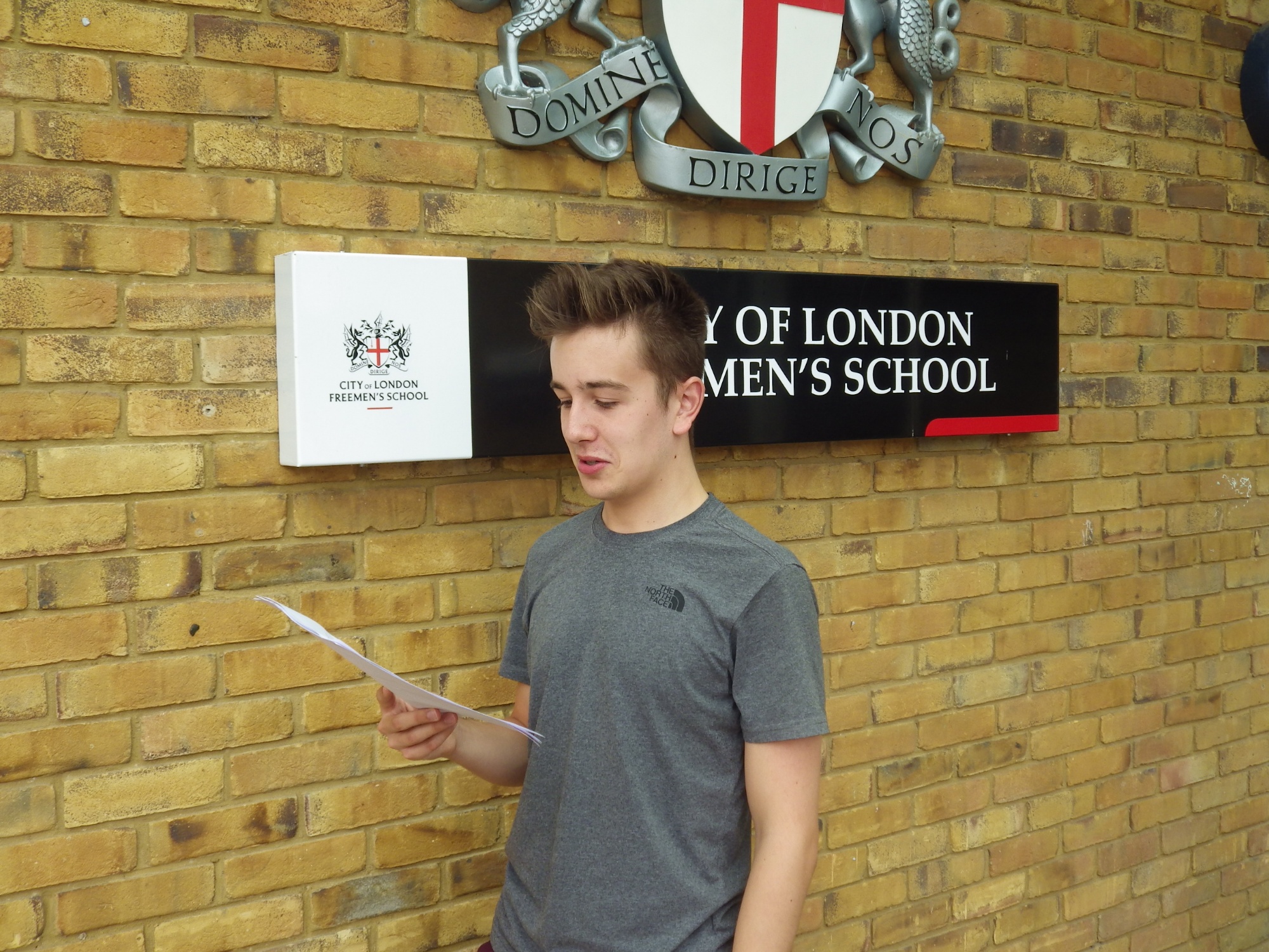 Lewis Blake checking GCSE results 2018 at City of London Freemen's School