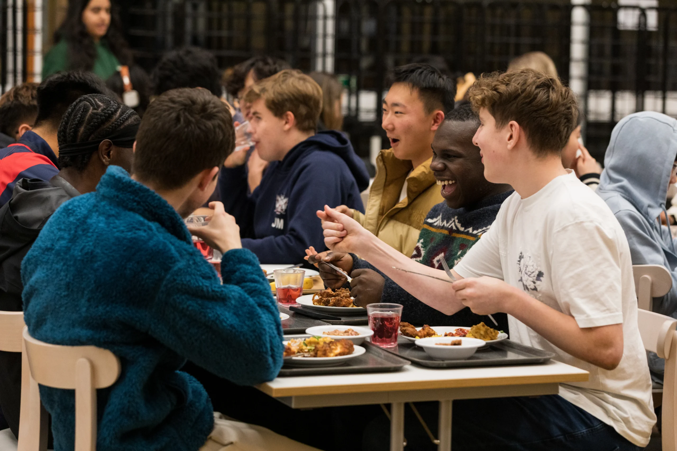 A group of boarding students having dinner