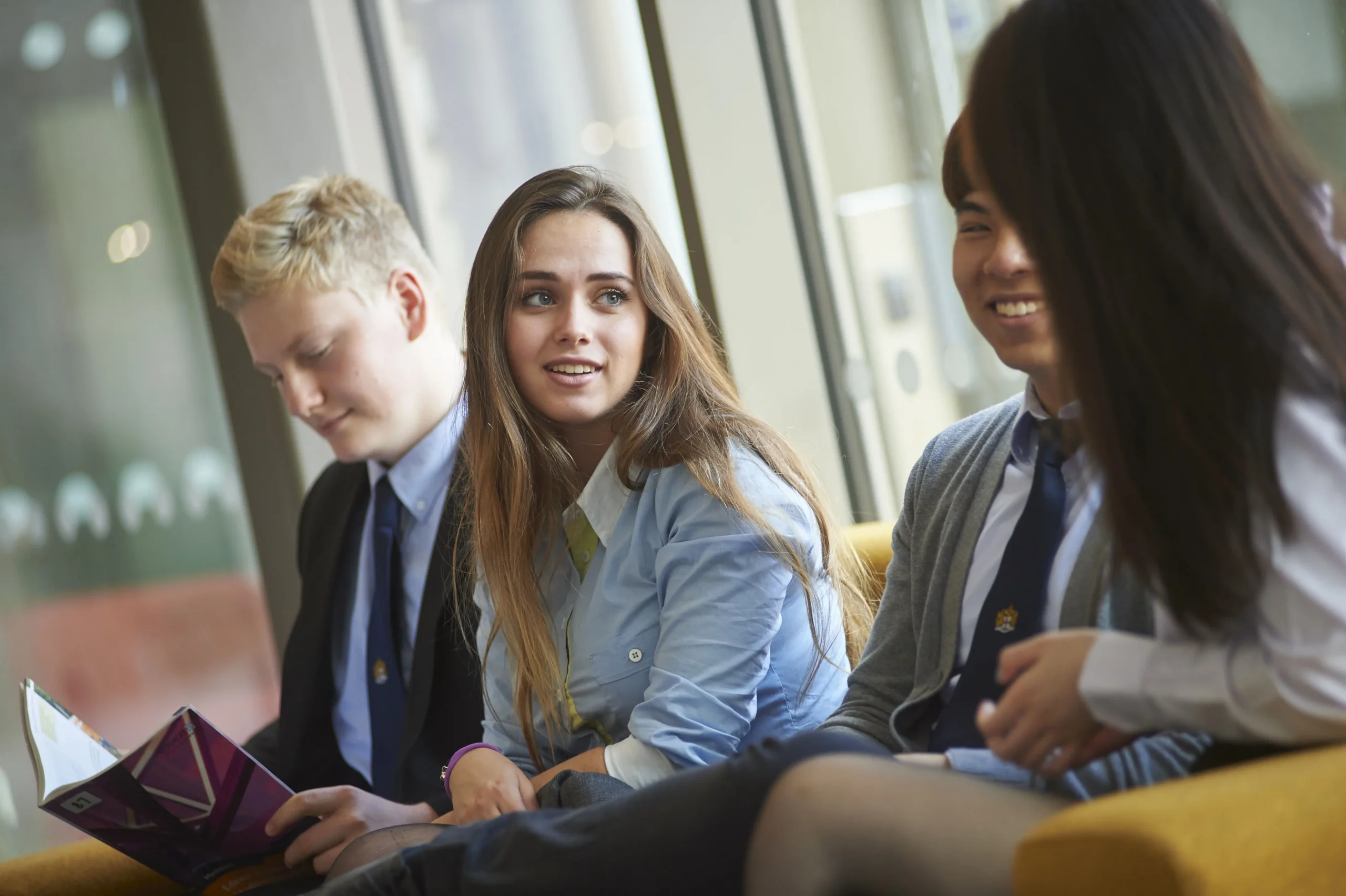 A group of students talking while sat down